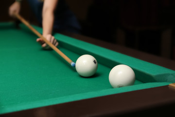 Woman having game of billiards