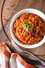 Brown stewed lentils in bowl