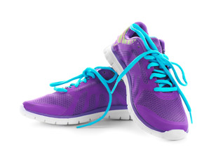 Pair of violet tennis shoes, isolated on white