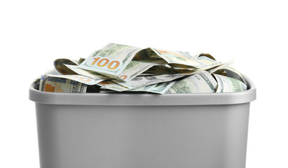 Dollar bills in dustbin, isolated on white