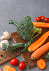 Wooden desk with fresh vegetables, copy space, cooking backgroung.