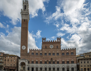 Fototapeta na wymiar City Hall Bell Tower, closeup view in Siena