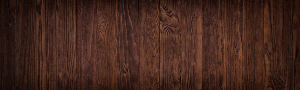 Dark wooden surface of a table or floor surface, gloomy wood texture