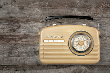 Retro radio on wooden background