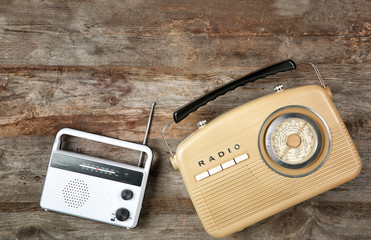 Retro radios on wooden background