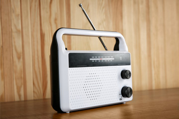 Retro radio on wooden background