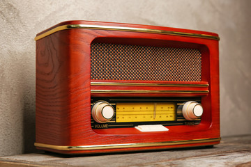 Retro radio on color background