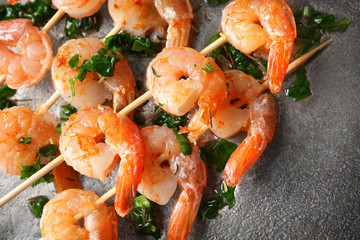 Skewers with delicious grilled shrimps, closeup