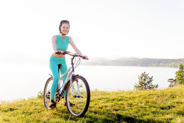 Naklejka premium Girl travelling on a bicycle