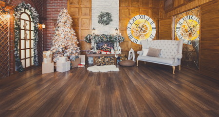 Cozy christmas interior with fir tree and fireplace