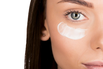 woman with moisturizing cream on face