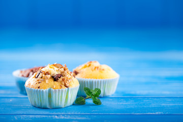 Fresh muffins with nuts and chocolate