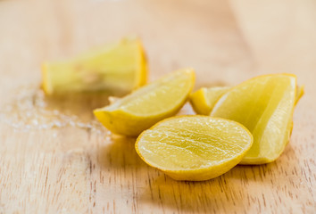 cutting lemon on board