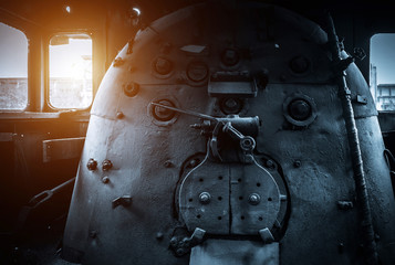 Old abandoned rusty steam locomotive interior