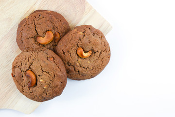 Cashews cookie on wooden boards and white background.