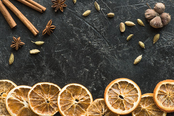 dried oranges with seeds and carnation
