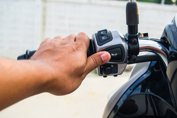 The driver's hand, the horn press