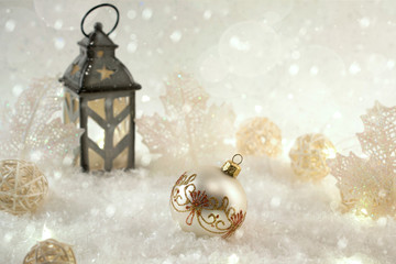 New Year's decoration ball on snow background. Christmas card
