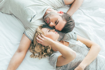 Obraz na płótnie Canvas couple in love on bed