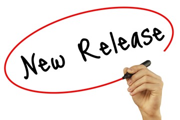 Man Hand writing New Release with black marker on visual screen. Isolated on background. Business, technology, internet concept. Stock Photo