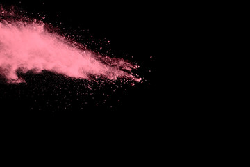 abstract pink dust explosion on  black background.abstract pink powder splattered on dark ...