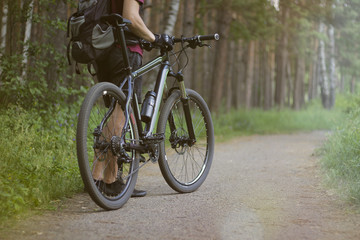 Fototapeta na wymiar Man with the bike in the woods