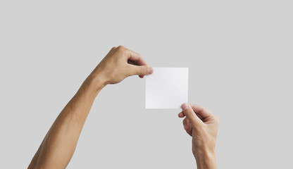 Two hand holding square paper in the hand. Leaflet presentation. Pamphlet hand man. Man show offset...