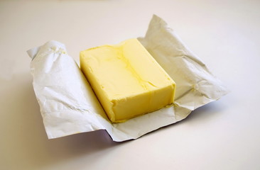 Opened butter package on table. Butter prices are at a record high.