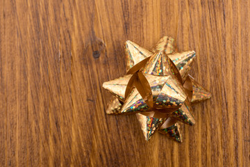 christmas bow on a wooden background