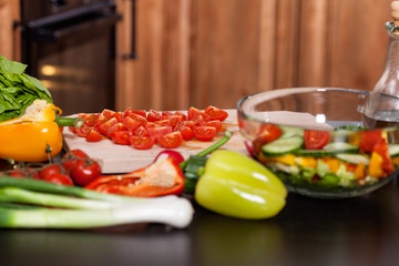 Ingredients of a vegetable salad on the kitchen table