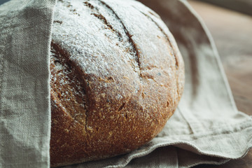Close-up  of fresh rye bread on a linen towel.