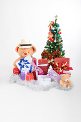 Bear doll with boxs gifts and christmas tree on white background in christmas festival
