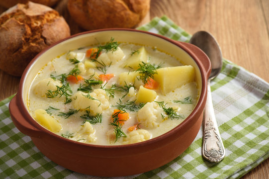 Healthy soup with cauliflower, carrot and potatoes.