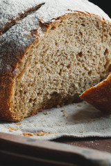 Close-up of chopped fresh rye bread on a linen towel.