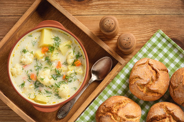 Healthy soup with cauliflower, carrot and potatoes.