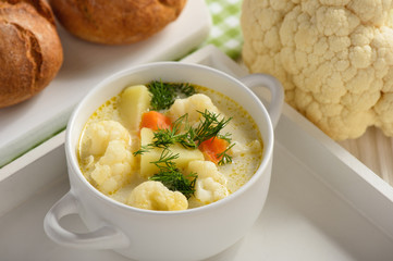 Healthy soup with cauliflower, carrot and potatoes.