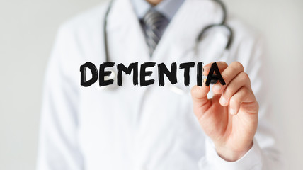 Doctor writing word DEMENTIA with marker, Medical concept