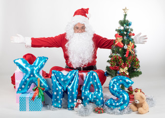 Santa claus with gifts boxs and christmas tree on white background in merry Xmas concept