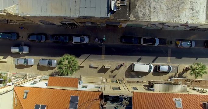 Descending birds eye view of a side street in Tel Aviv
