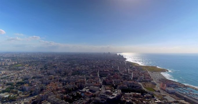 Aerial extreme wide angle shot of Tel Aviv along the Mediterranean Sea
