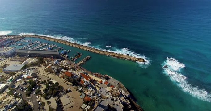 High aerial shot looking at a sand bar along the shore of the Mediterranean Sea