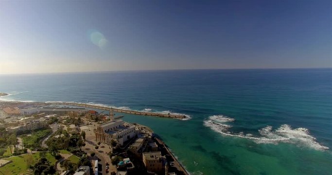 Slow aerial pan of the Mediterranean Sea next to Tel Aviv