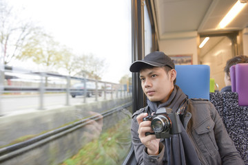 Asian man travel in train Switzerland