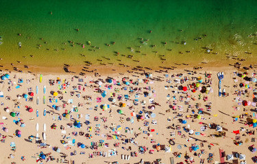 Fototapeta premium Aerial Summer View Of People Crowd Having Fun On Cascais Beach In Portugal