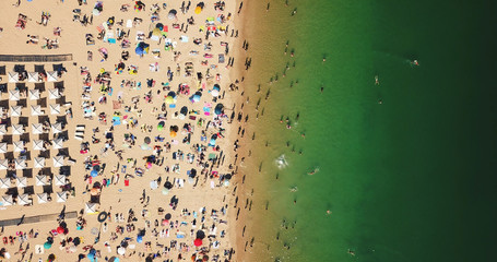Aerial Summer View Of People Crowd Having Fun On Cascais Beach In Portugal