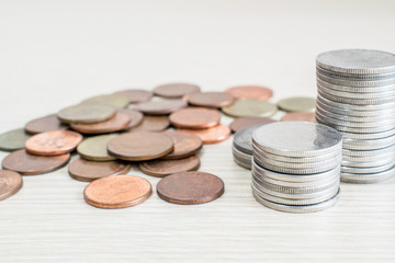 coins stacked same tower on desk