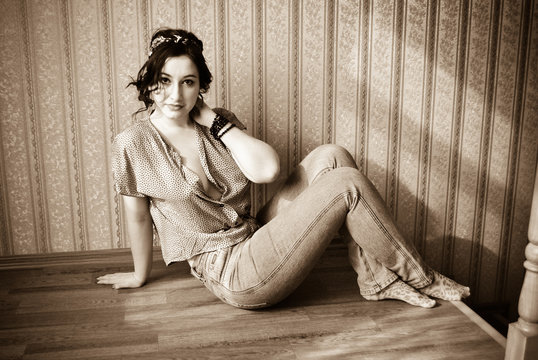 Young Lady with pale skin plus size in vintage pin up retro style at cozy home. Pretty casual retro style 40-5 years for xl size woman