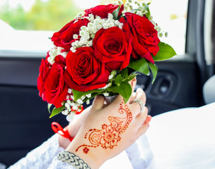 A wedding day, a young Muslim woman with a scarf on his head, holds flowers, a wedding, an event, a...