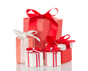 Big and small boxes with gifts, decorated with ribbons, isolated on white