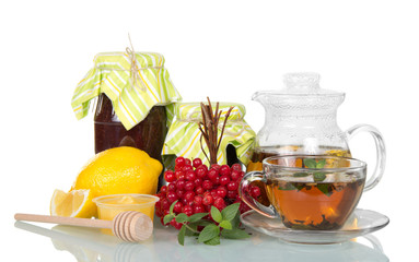 Banks with jam, hot tea with lemon for cold, bunch of berries of viburnum, isolated on white